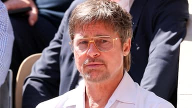 Brad Pitt schaut traurig mit Brille