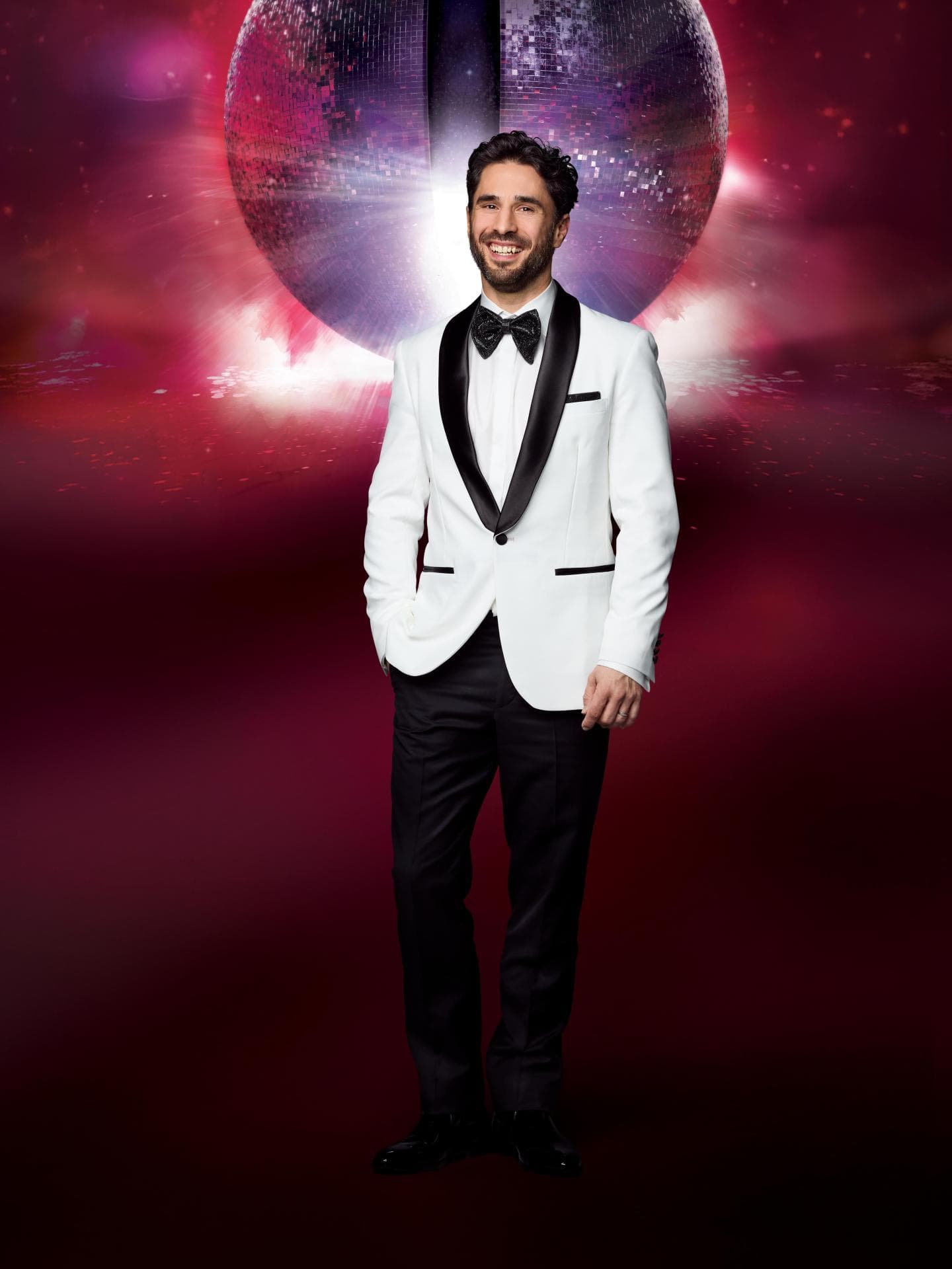 Jan Kittmann im weißen Anzug