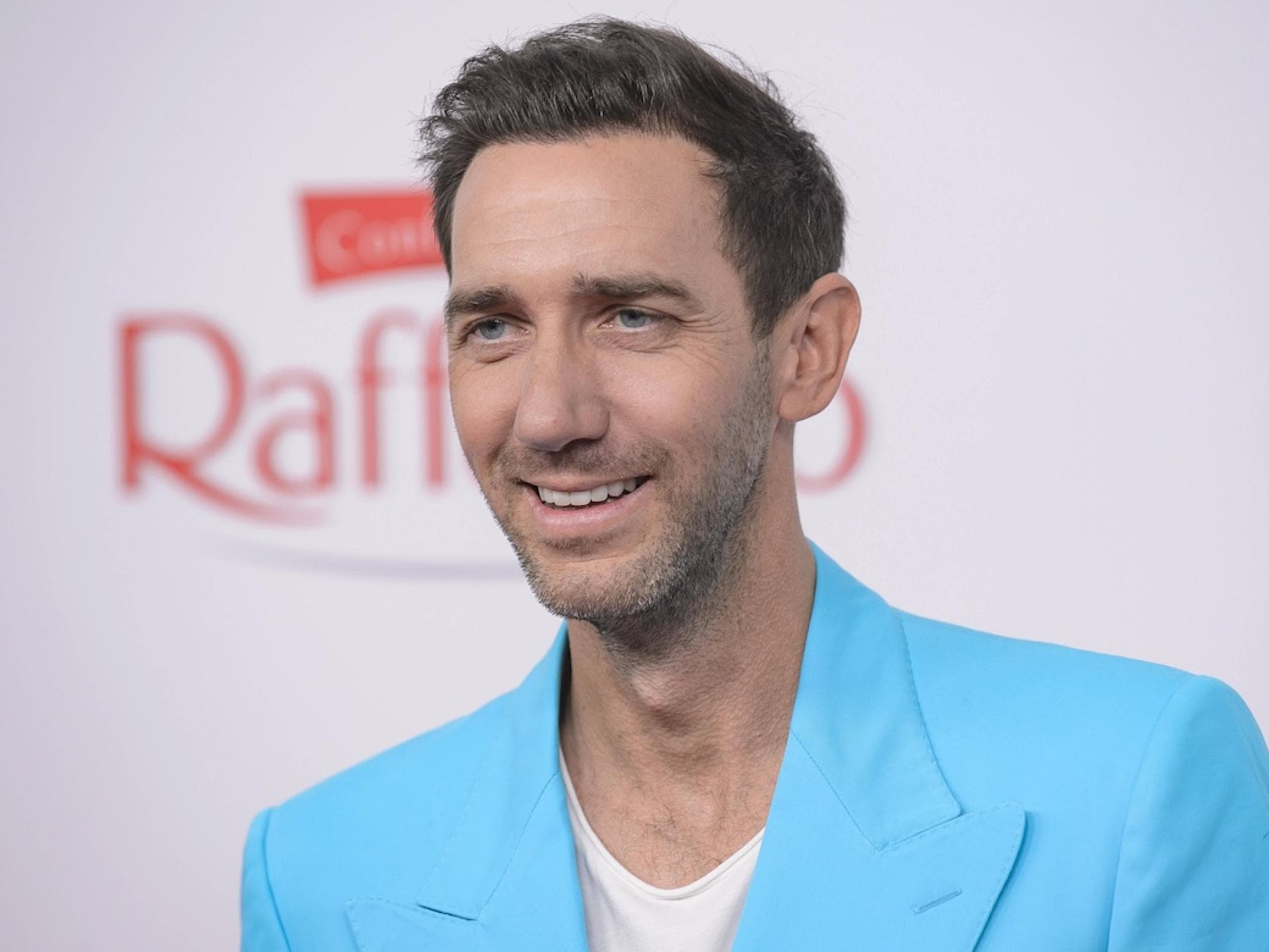 Marcel Remus im blauen Anzug