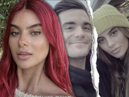 Romina Palm macht ein Selfie, im Hintergrund ist ein Bild von ihr und Stefano Zarrella zerrissen