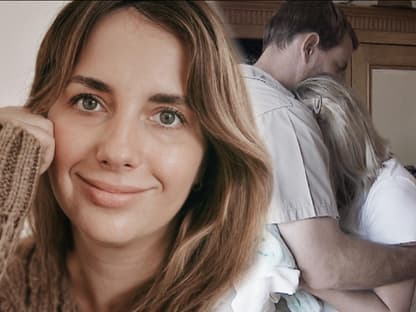 Anna Heiser blickt in die Kamera, im Hintergrund heult sie sich in Geralds Armen aus