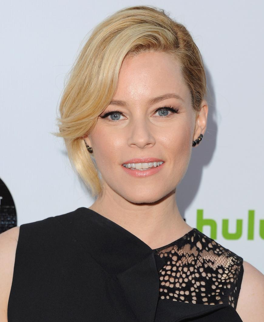 Die Schauspielerin Elisabeth Banks mit senkrechtem Doppel-Knoten als Hochsteckfrisur.