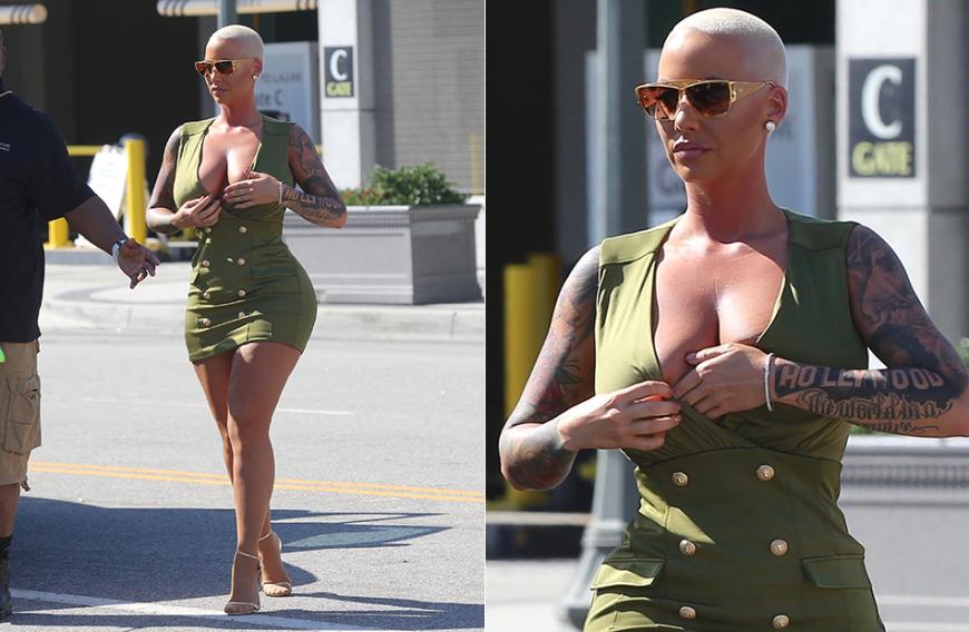 Amber Rose sorgte kürzlich noch mit einem Unten-ohne-Pic für mächtig Wirbel. Damit auch obenrum alles sitzt, rückt das kurvige Model noch mal ihr Dekolleté im knackengen olivgrünen Kleid zurecht. Sitzt alles, Amber!