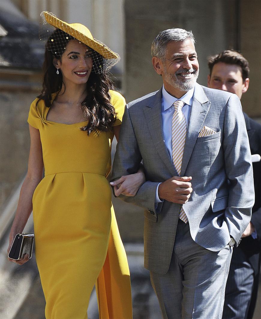 ... sondern auf das Hollywood-Paar Amal und George Clooney, die auch schon zur royalen Hochzeit eingeladen waren.