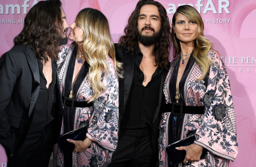 Total verschmust auf dem roten Teppich: Heidi Klum und Tom Kaulitz turteln auf der amfAR-Gala in Paris. Die Blondine trägt einen außergewöhnlichen Look mit Kimono und ausdrucksstarkem Make-up.