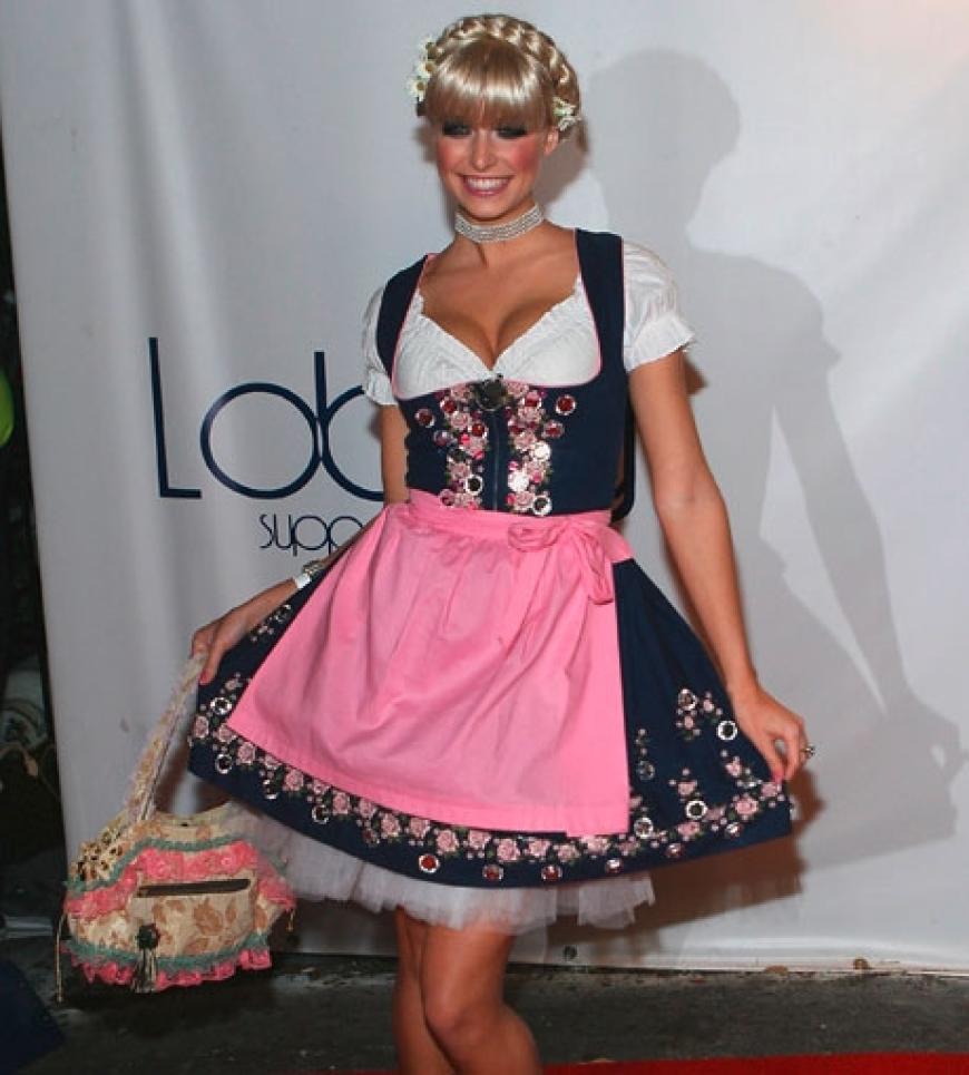Topmodel-Gewinnerin Lena Gercke vertritt das typisch deutsche Klischee in den USA: Im Oktoberfest-Outfit kommt sie als bayerische Zopfliesel
