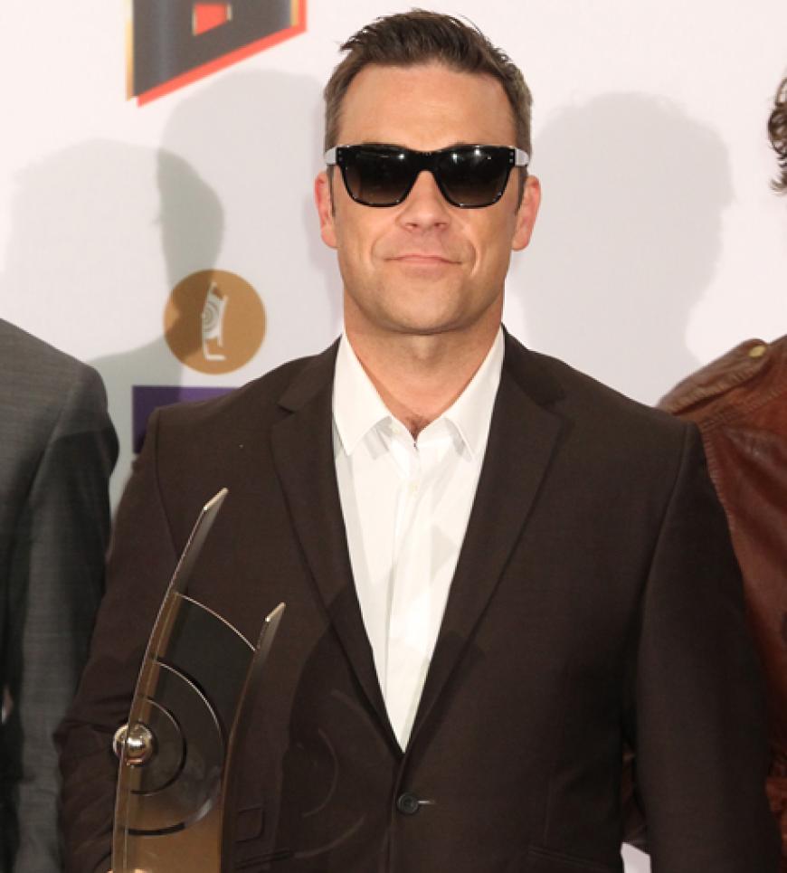 Robbie Williams und seine Jungs von