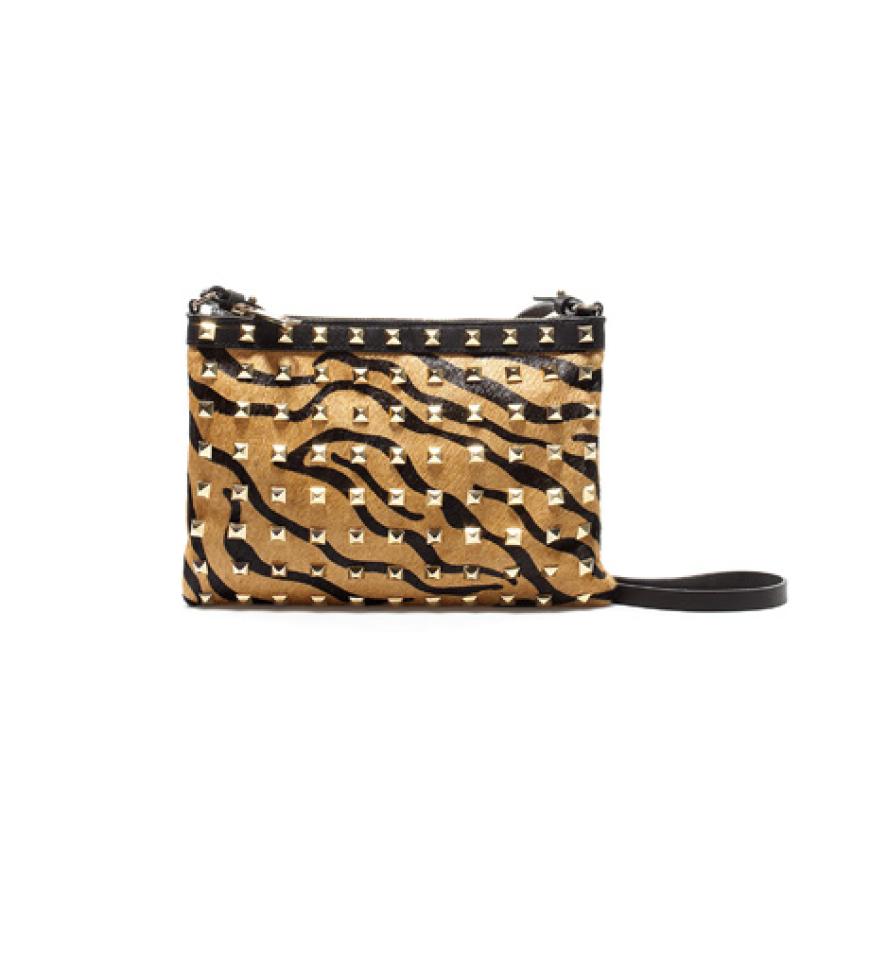 29. August 2012: Rock it baby! Mit der Nieten-Clutch im Tiger-Look sind wir der Star auf der nächsten Party. Tasche von Zara, ca. 80 Euro