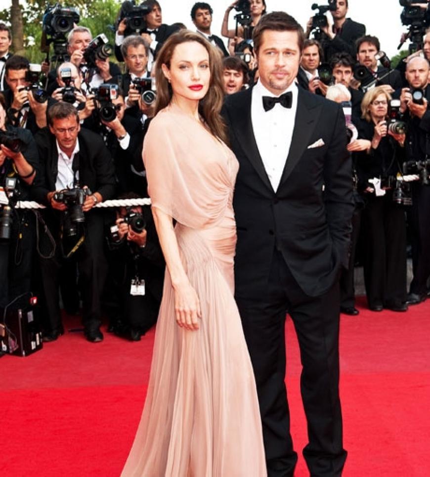 Lächeln die Krisen-Gerüchte einfach weg: Angelina Jolie und Brad Pitt bei den Filmfestspielen in Cannes