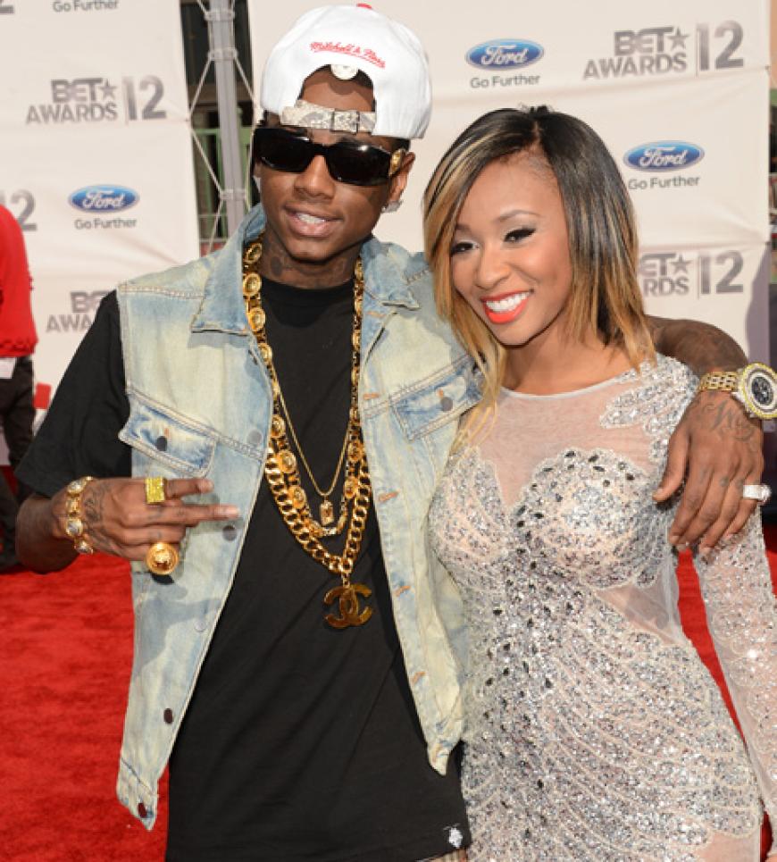 Posen wie ein echter Rapper: Soulja Boy mit viel Bling-Bling und einer Frau an seiner Seite