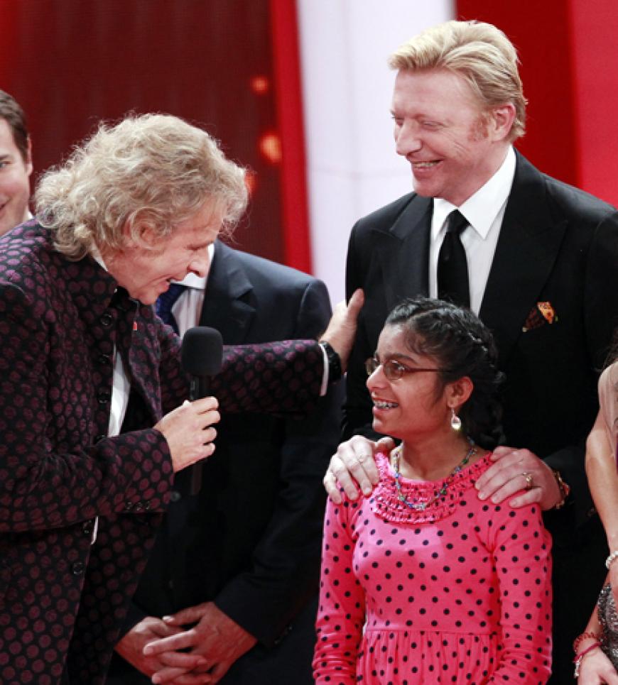 Thomas Gottschalk mit Boris Becker und einem Kind