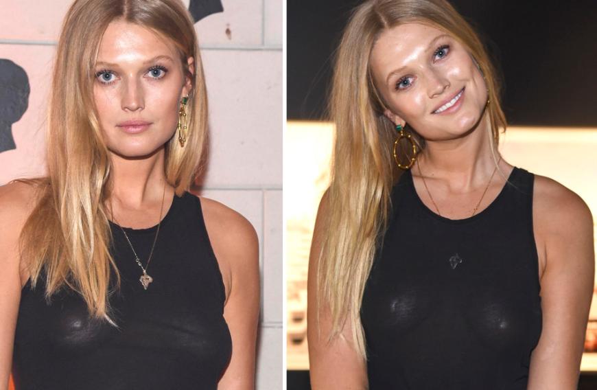 Das grelle Fotografen-Licht offenbart, dass Toni Garrn definitiv keinen BH unter ihrem schwarzen Top trägt.