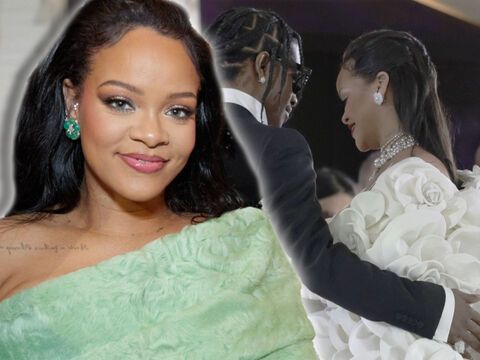 Rihanna lächelt, im Hintergrund legt A$AP Rocky Arm um sie