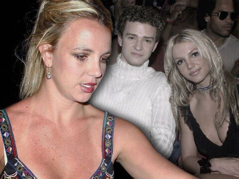 Britney Spears sieht fertig aus, ein Bild von ihr mit Justin Timberlake ist im Hintergrund zu sehen