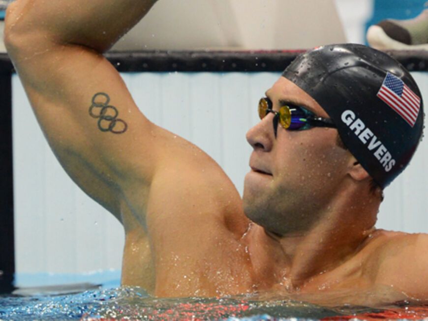 Der Amerikaner Matthew Grevers hat sich nicht umsonst die olympischen Ringe auf dem Oberarm verewigen lassen