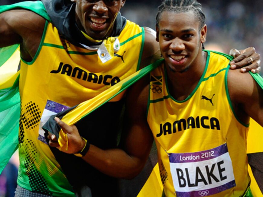 Nur sein Landsmann Usain Bolt ist noch schneller und freut sich zusammen mit dem 22-Jährigen über die Medaillen