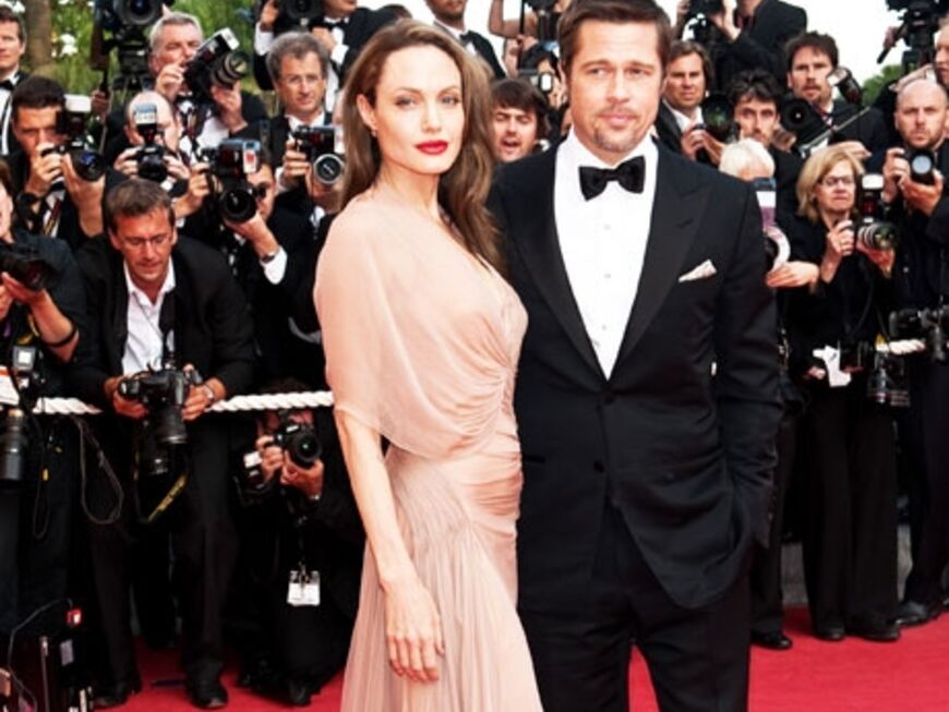 Lächeln die Krisen-Gerüchte einfach weg: Angelina Jolie und Brad Pitt bei den Filmfestspielen in Cannes