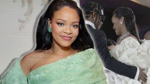 Rihanna lächelt, im Hintergrund legt A$AP Rocky Arm um sie