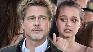 Brad Pitt und Shiloh Jolie-Pitt blicken besorgt zur Seite